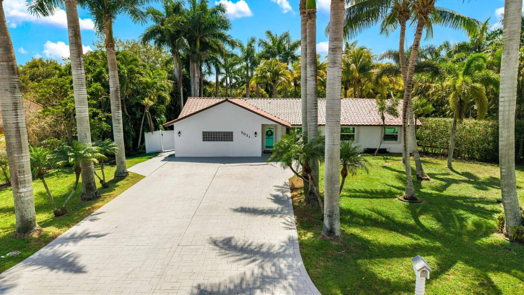 5021 Southwest 201st Terrace Southwest Ranches, FL 33332 - Photo 1 of 50 a house view with a garden space