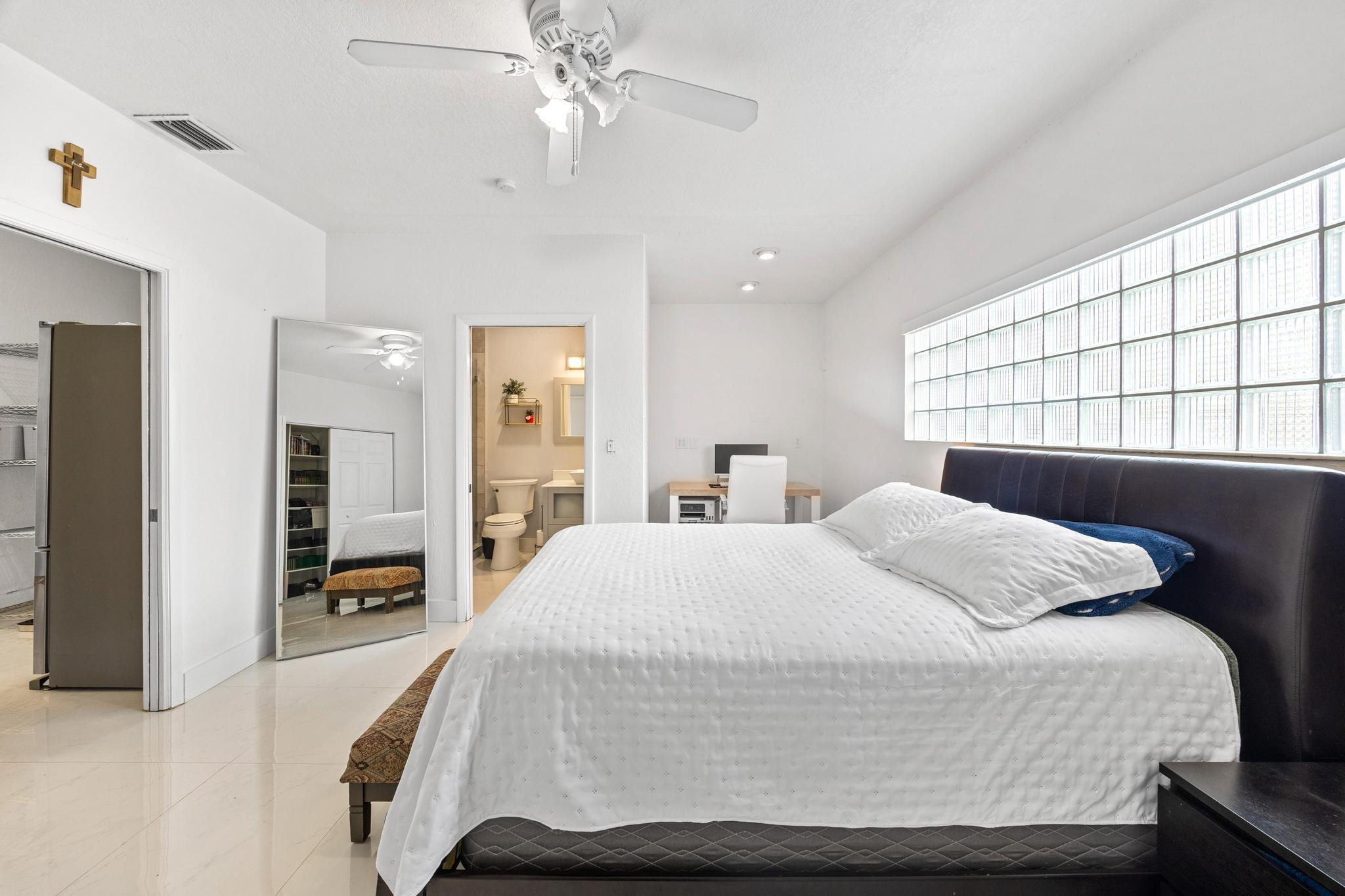 5021 Southwest 201st Terrace Southwest Ranches, FL 33332 - Photo 21 of 50 a bedroom with a large bed and a chandelier
