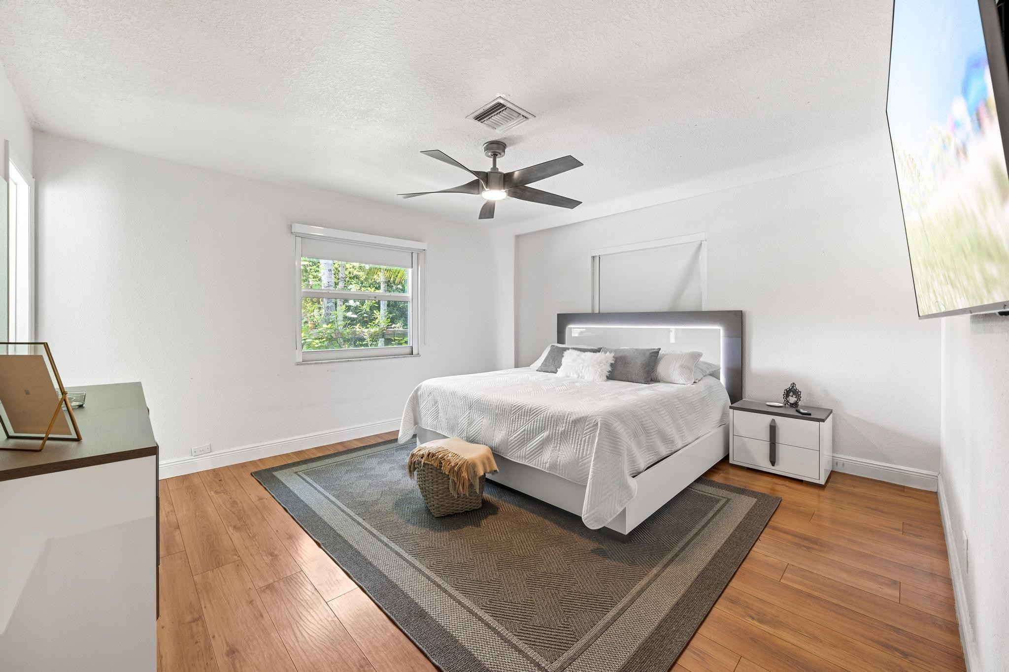 5021 Southwest 201st Terrace Southwest Ranches, FL 33332 - Photo 28 of 50 a bedroom with a bed and wooden floor