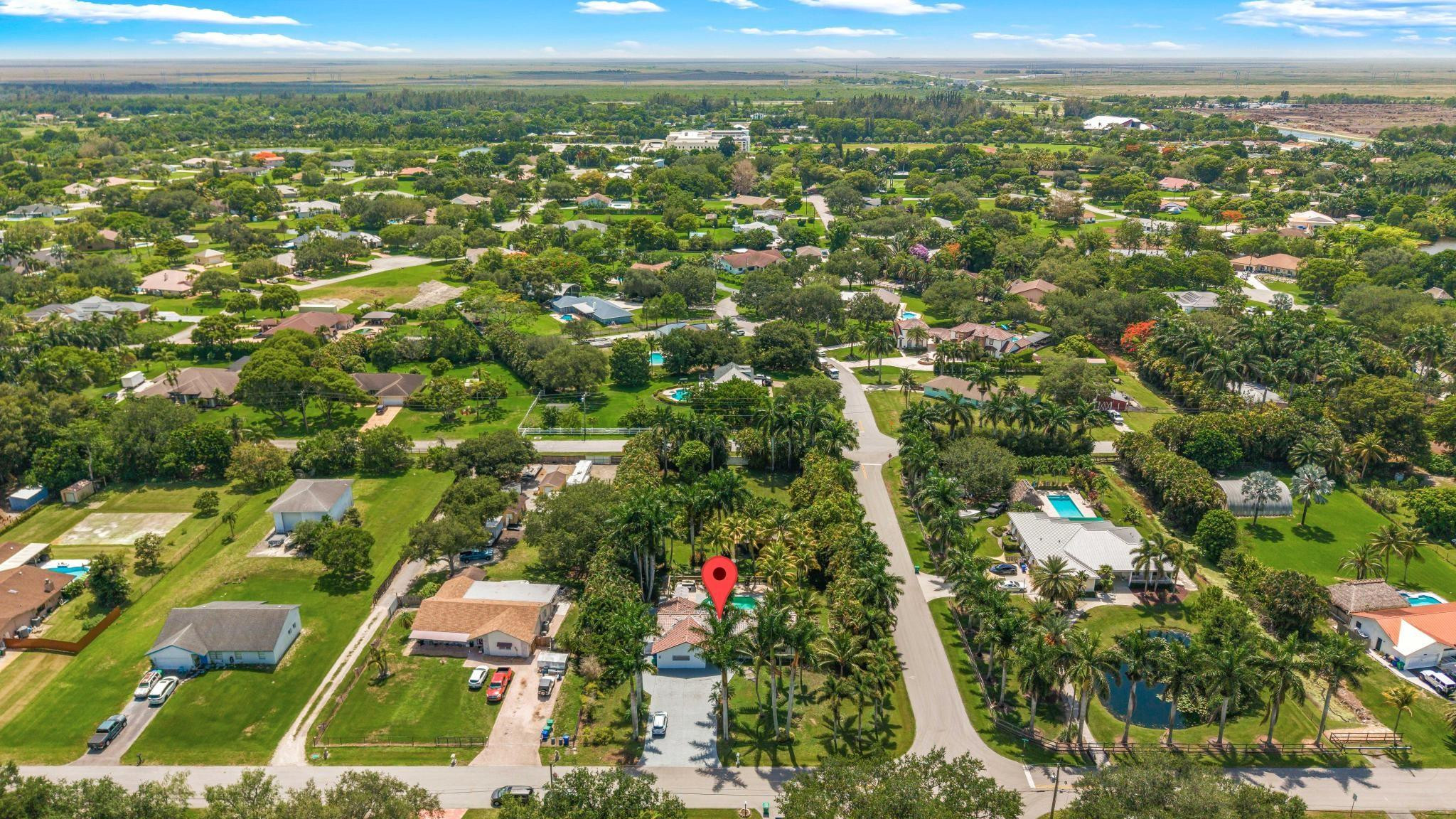 5021 Southwest 201st Terrace Southwest Ranches, FL 33332 - Photo 49 of 50 an aerial view of residential houses with outdoor space and trees