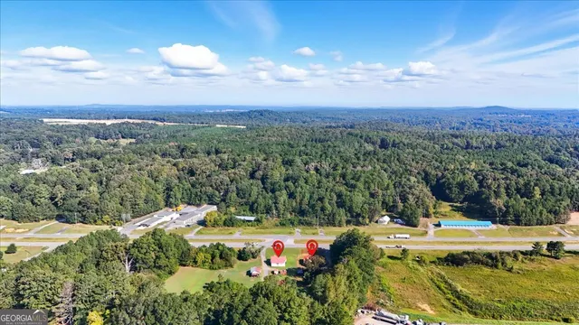 a view of a swimming pool with a yard