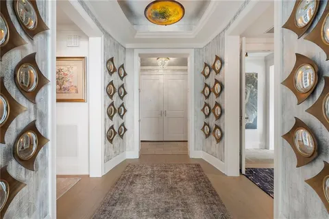 a view of an entryway with wooden floor