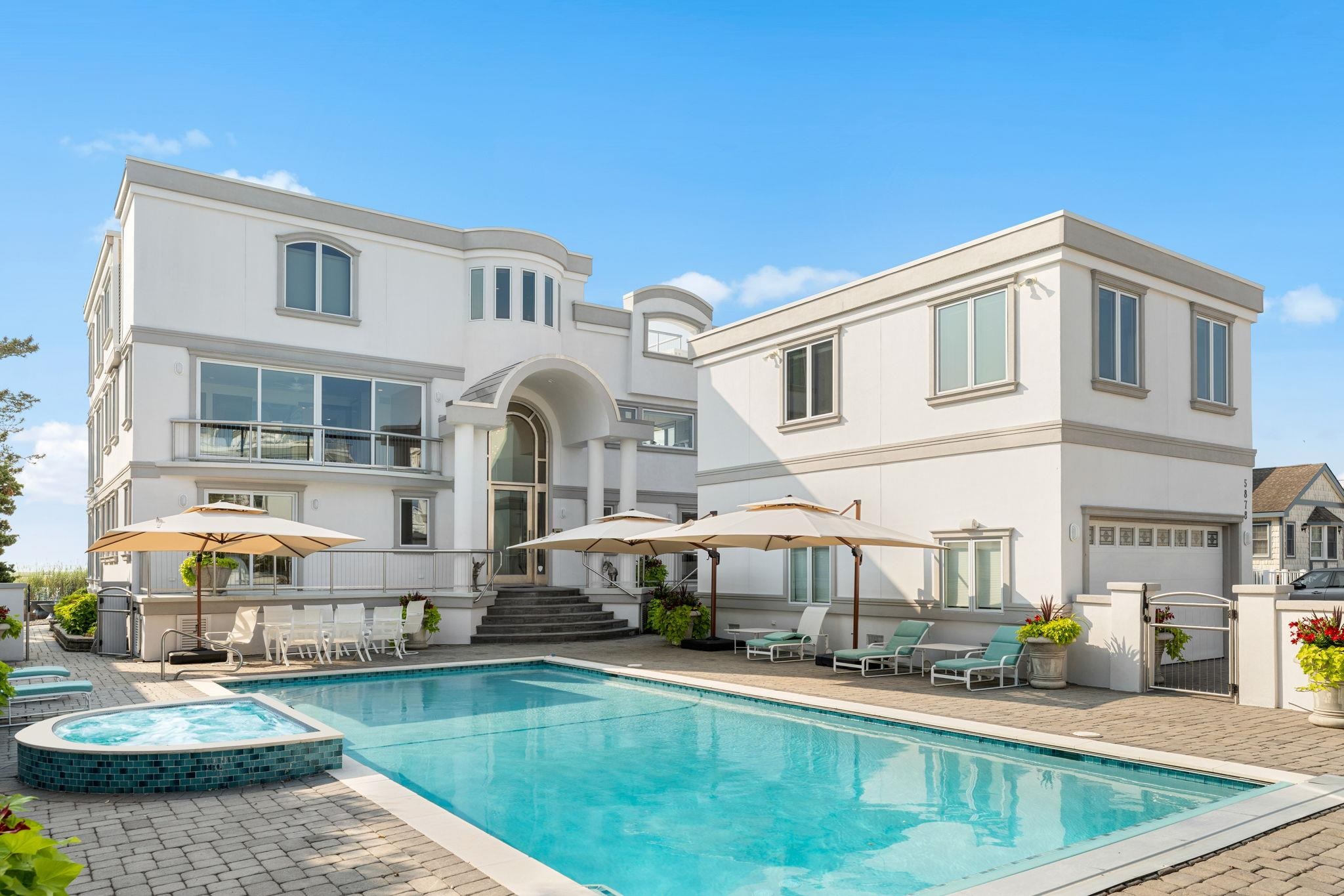 5878 Ocean Drive Avalon, NJ 08202 - Photo 1 of 50 a front view of a building with lake view
