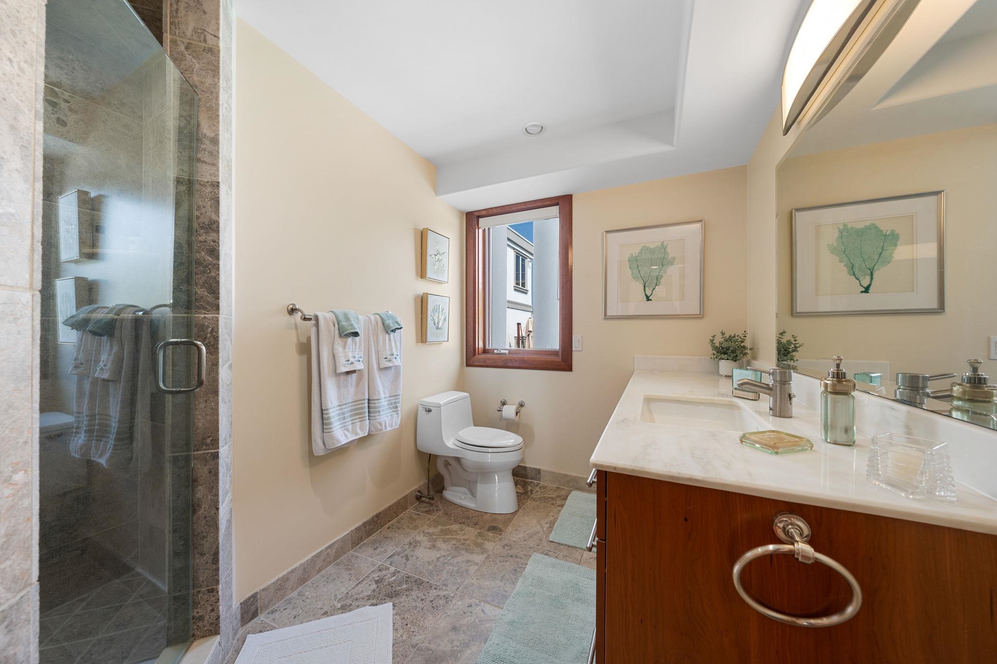 5878 Ocean Drive Avalon, NJ 08202 - Photo 12 of 50 a bathroom with a sink and a mirror