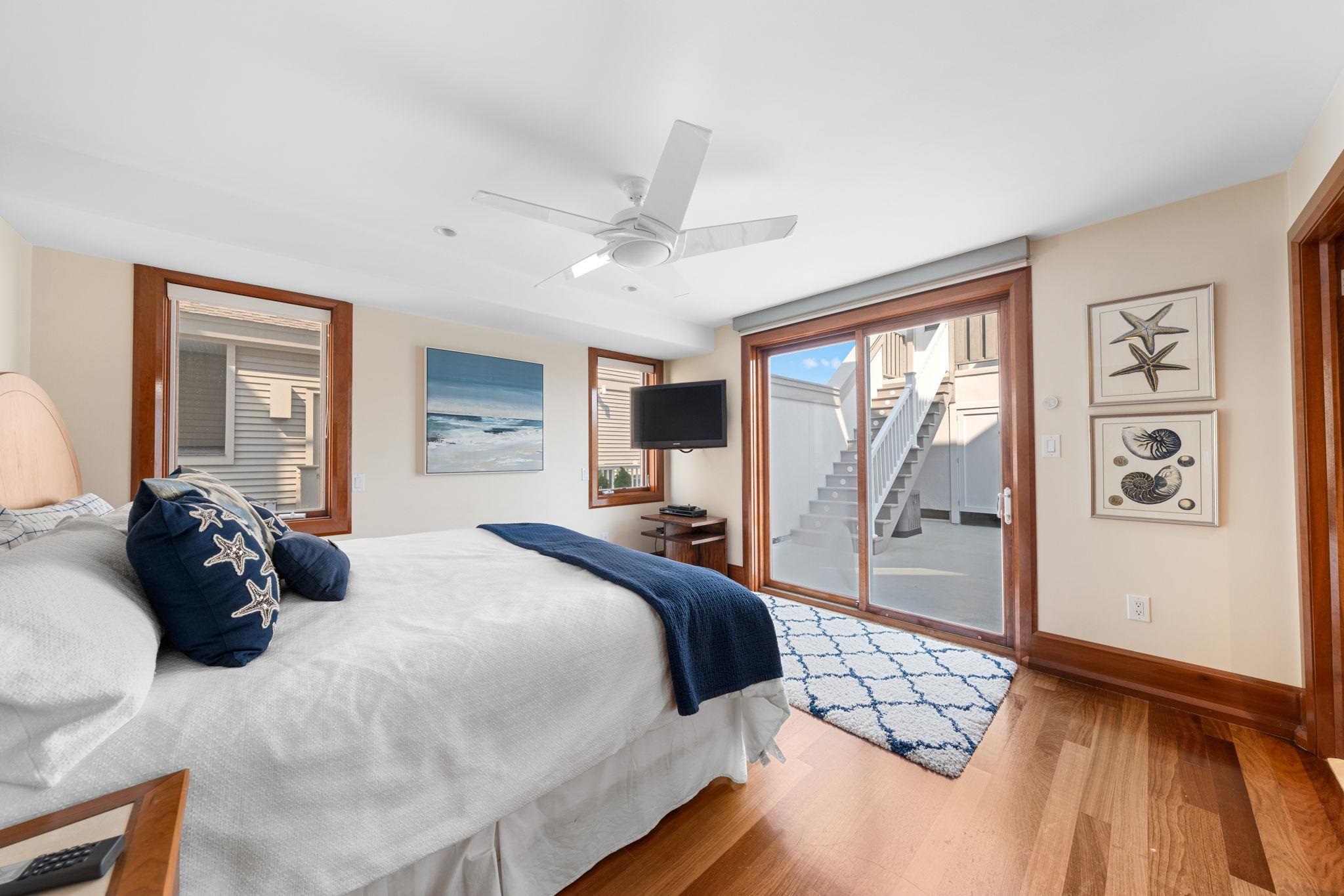 5878 Ocean Drive Avalon, NJ 08202 - Photo 15 of 50 a bedroom with a large bed and a large window