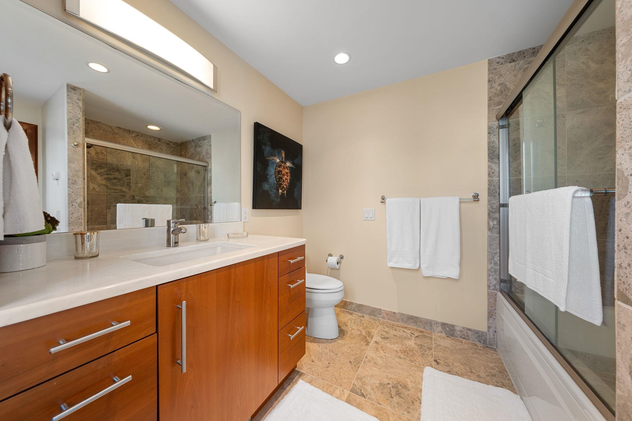 5878 Ocean Drive Avalon, NJ 08202 - Photo 16 of 50 a bathroom with a sink a toilet and mirror