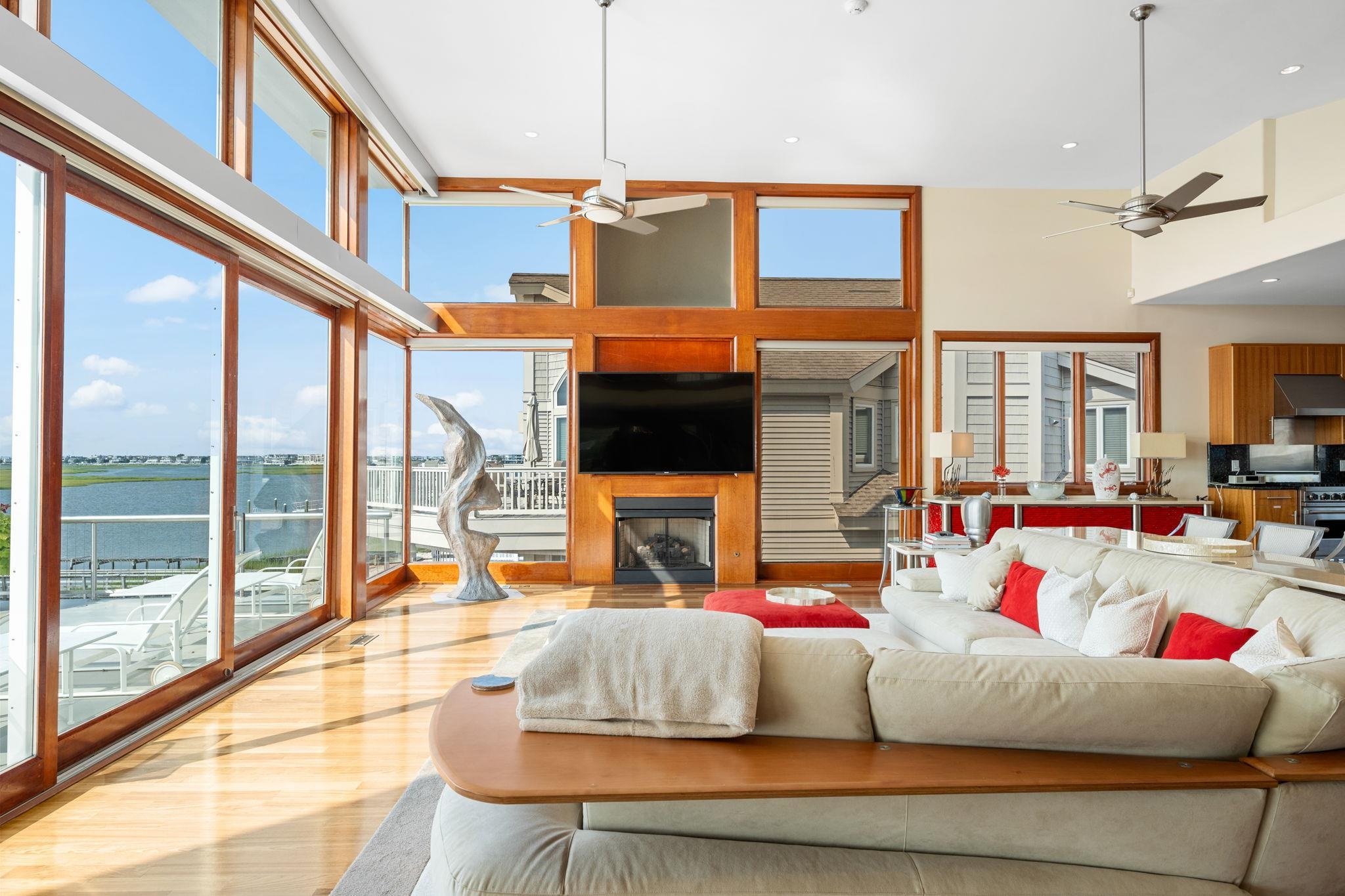 5878 Ocean Drive Avalon, NJ 08202 - Photo 19 of 50 a living room with fireplace furniture and a large window