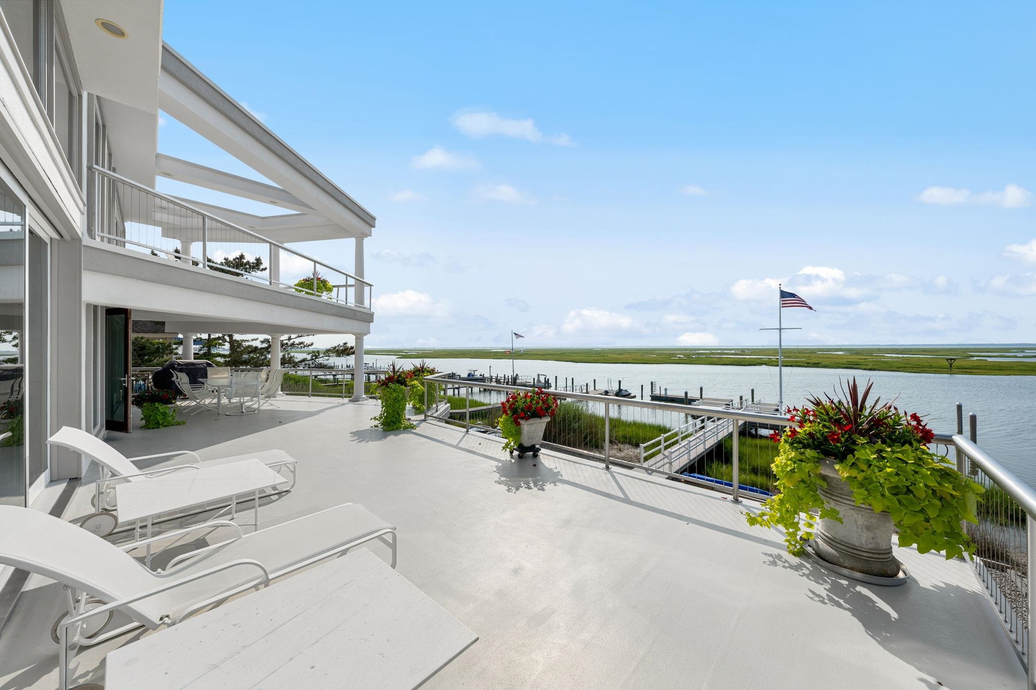 5878 Ocean Drive Avalon, NJ 08202 - Photo 27 of 50 a view of a swimming pool with a lounge chairs