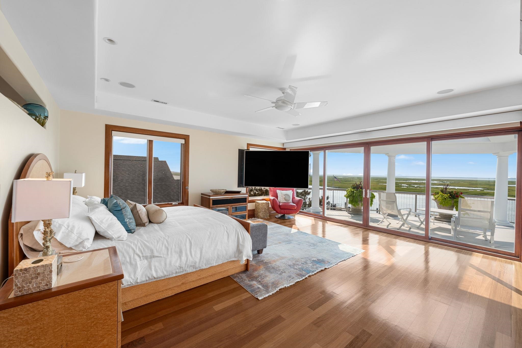 5878 Ocean Drive Avalon, NJ 08202 - Photo 34 of 50 a living room with furniture and a flat screen tv
