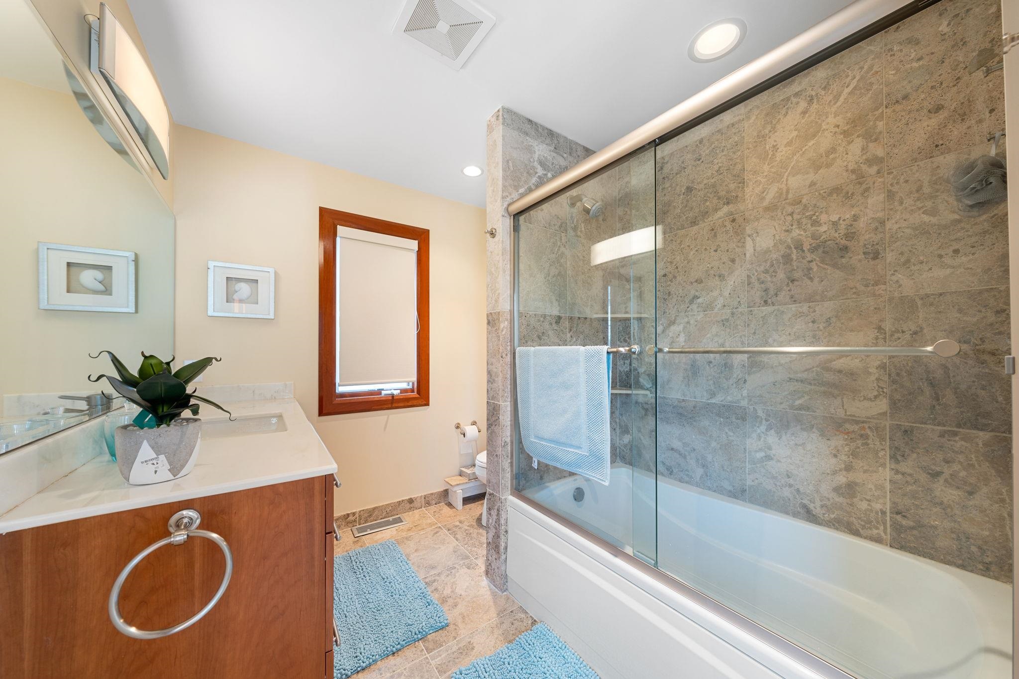 5878 Ocean Drive Avalon, NJ 08202 - Photo 47 of 50 a bath room with a sink and a bath tub