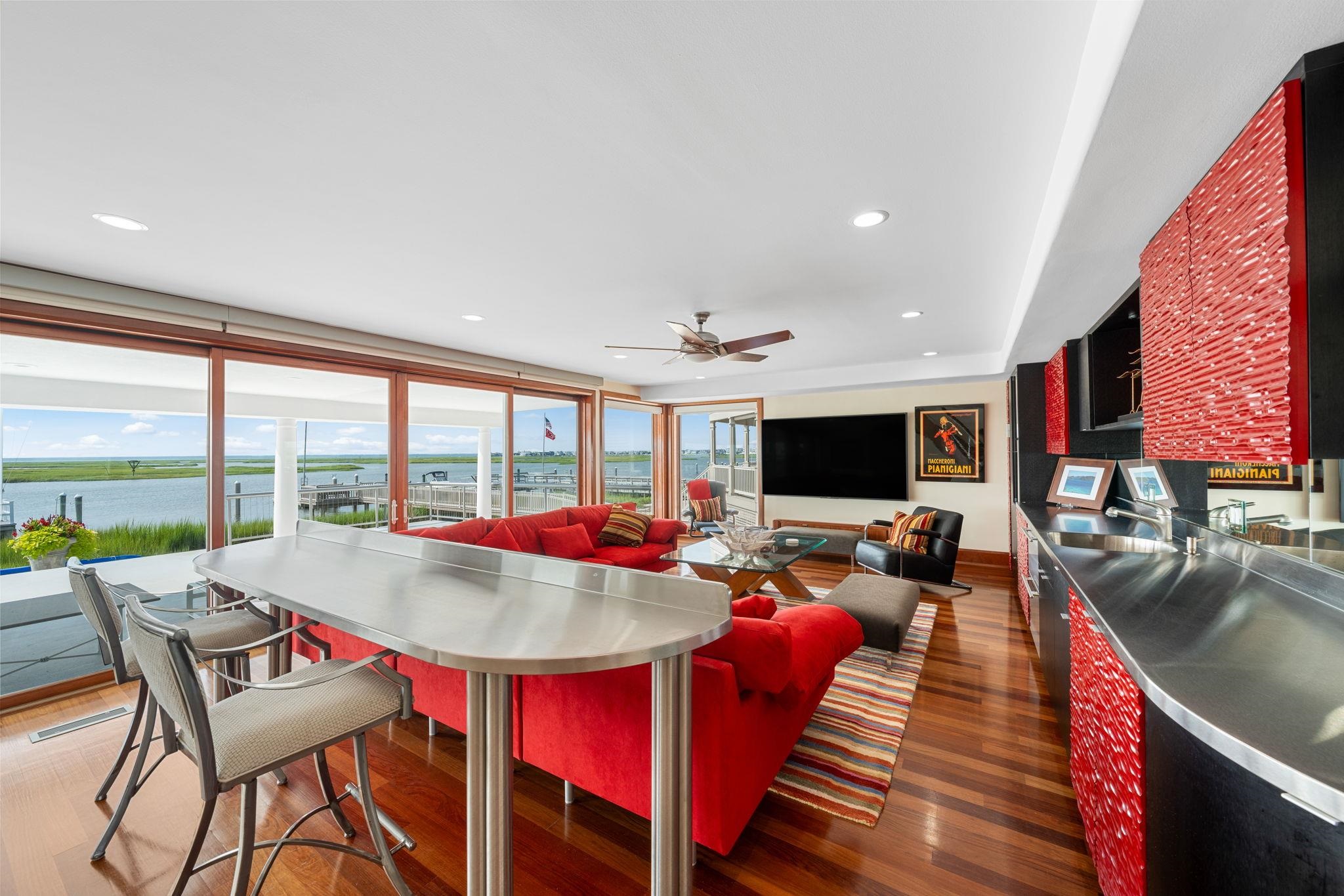 5878 Ocean Drive Avalon, NJ 08202 - Photo 8 of 50 a living room with furniture fireplace and large windows