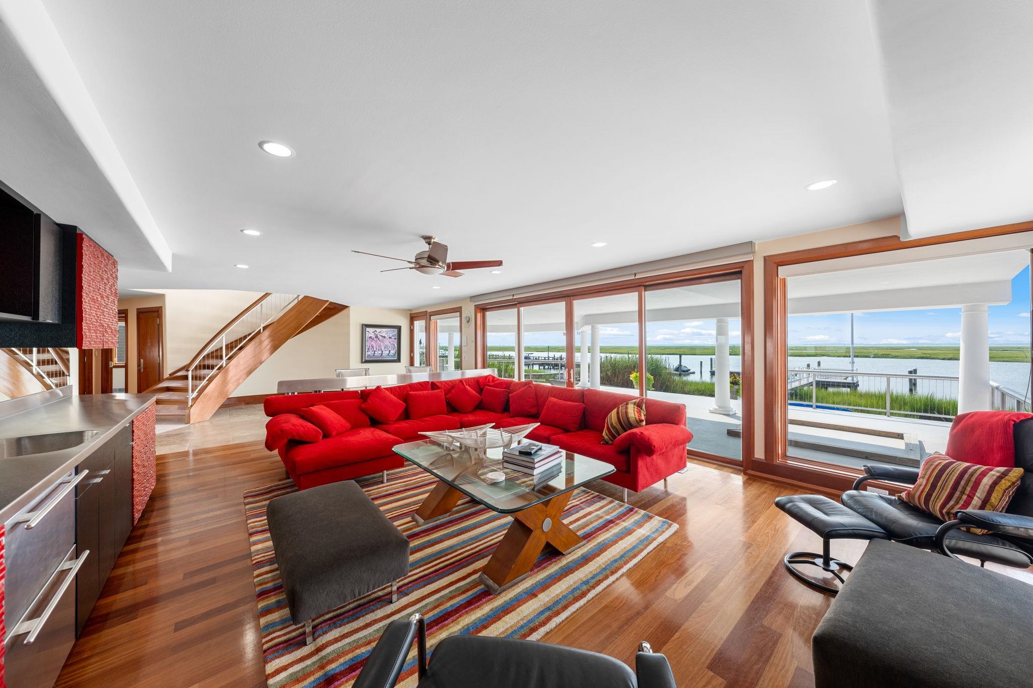 5878 Ocean Drive Avalon, NJ 08202 - Photo 9 of 50 a living room with furniture or couch and a large window