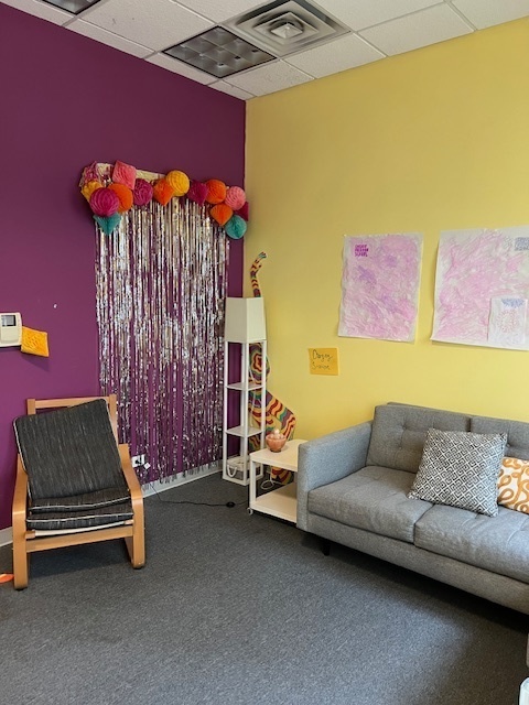 719 South State Street Chicago, IL 60605 - Photo 10 of 34 a couch sitting in a room next to a blue wall