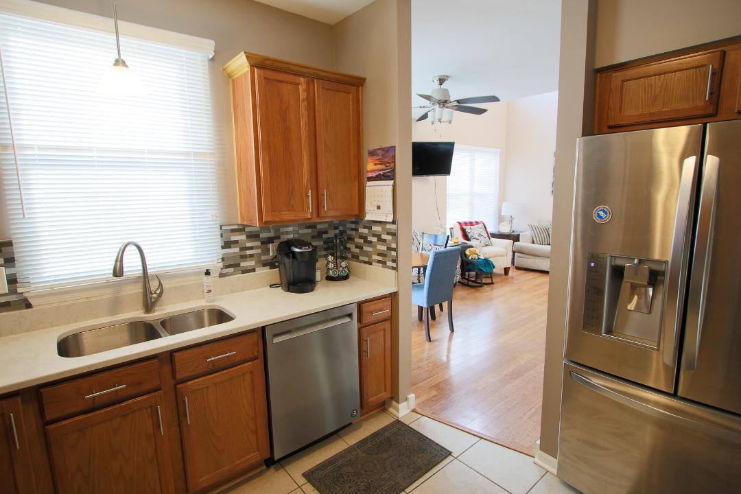 2136 Sunrise Circle Aurora, IL 60503 - Photo 11 of 21 a kitchen with refrigerator and sink