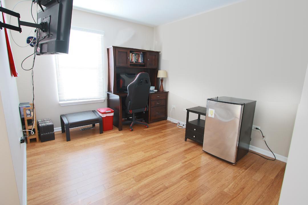 2136 Sunrise Circle Aurora, IL 60503 - Photo 16 of 21 a view of a workspace with furniture and a window