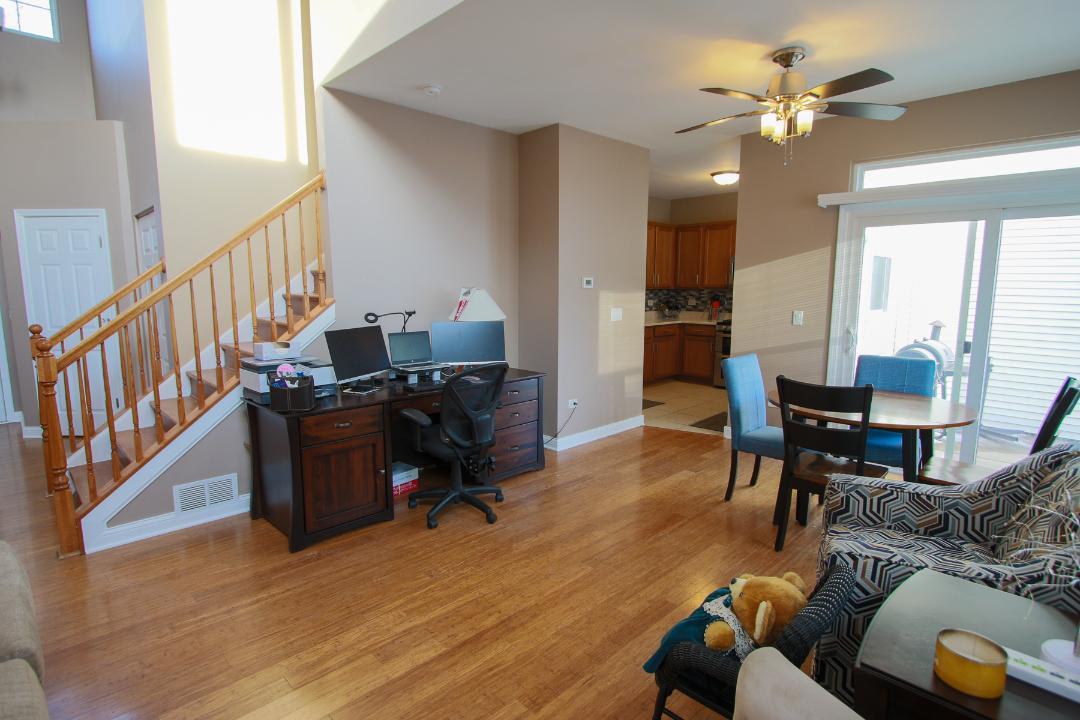 2136 Sunrise Circle Aurora, IL 60503 - Photo 3 of 21 a living room with furniture and a piano