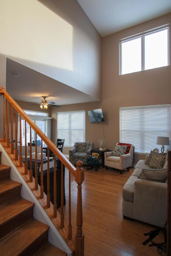 2136 Sunrise Circle Aurora, IL 60503 - Photo 4 of 21 a view of livingroom with furniture and stairs