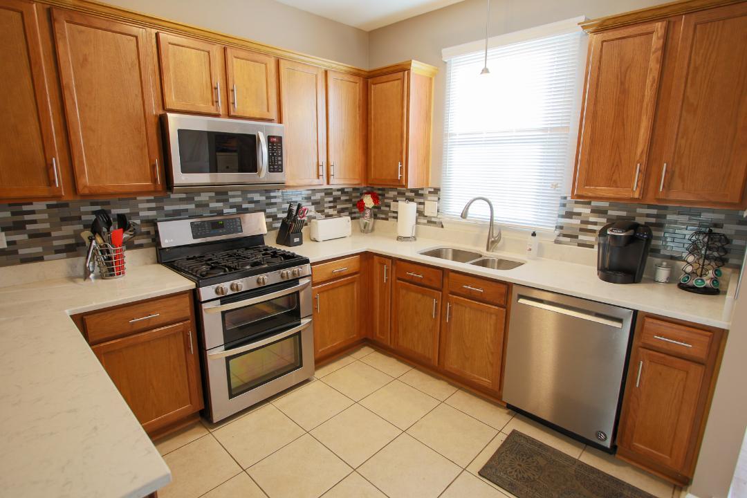 2136 Sunrise Circle Aurora, IL 60503 - Photo 10 of 21 a kitchen with a sink stove and microwave