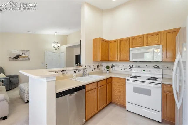 a kitchen with a sink stove and refrigerator