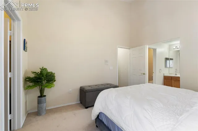 a spacious bathroom with a double vanity sink and a mirror