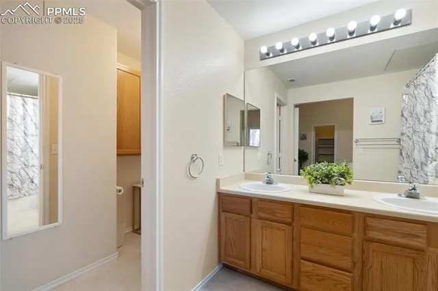 a white toilet sitting next to a bathroom sink
