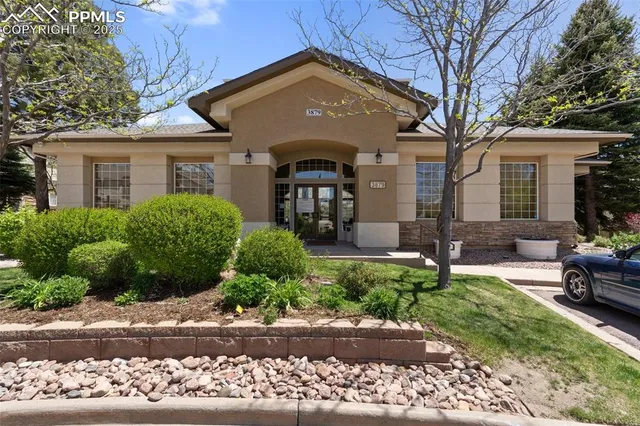 a view of a house with a yard and a sink