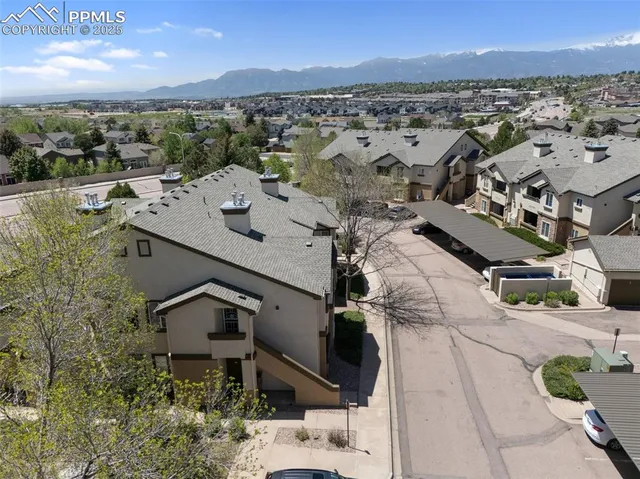 an aerial view of residential houses with outdoor space