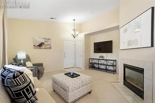 a bedroom with furniture and a flat screen tv