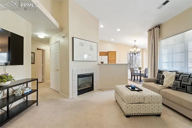 a spacious bedroom with a bed and a flat screen television