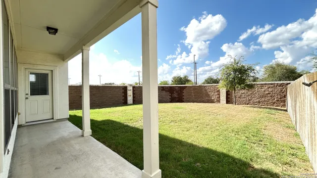 a view of back yard of the house