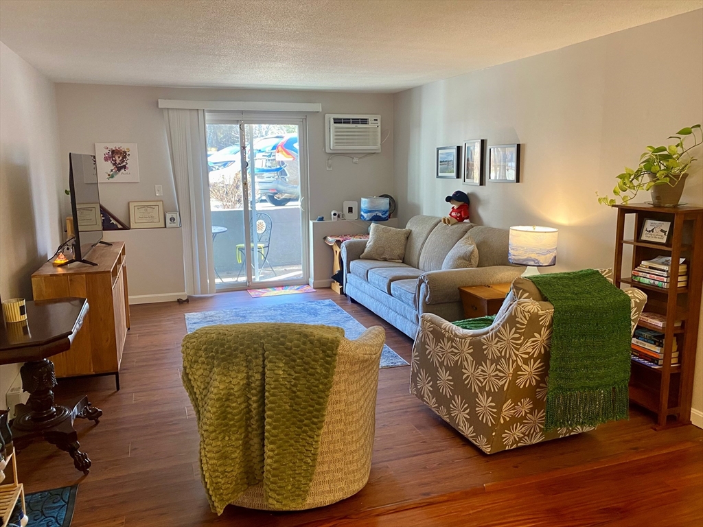 200 Manning Street, Unit 2B Hudson, MA 01749 - Photo 5 of 9 a living room with furniture rug and window