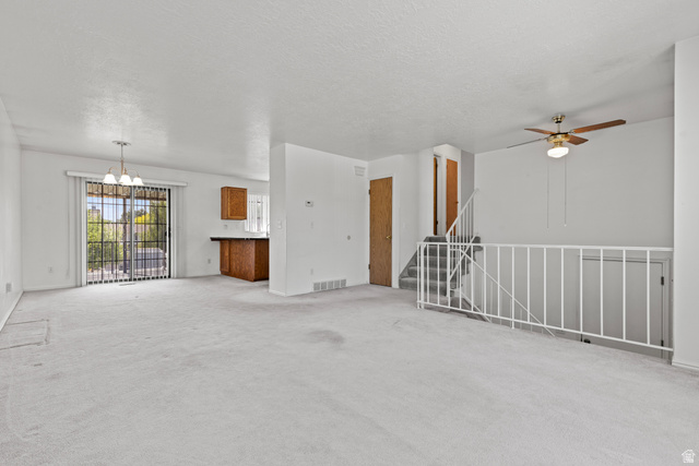 5643 South 2950th Street West Roy, UT 84067 - Photo 4 of 12 Open-concept area opens to deck