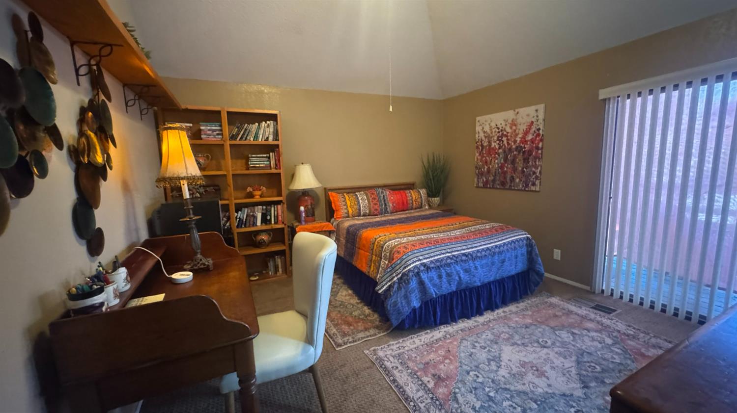 31160 Revis Road Coarsegold, CA 93614 - Photo 9 of 15 a bedroom with a bed a table and chair