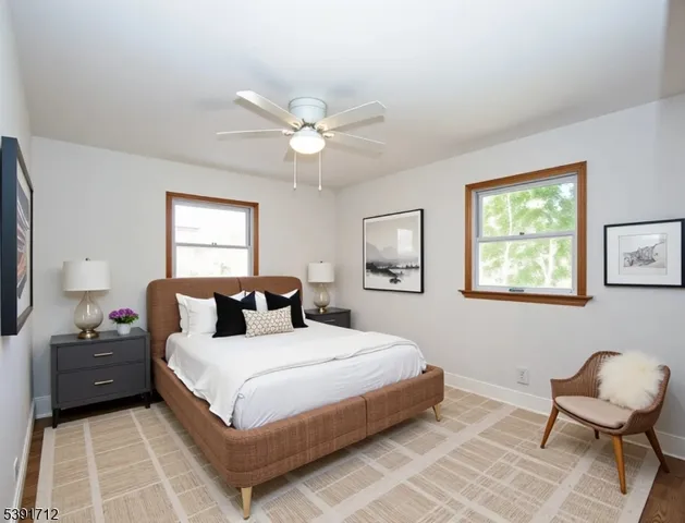 a bedroom with a bed and chair