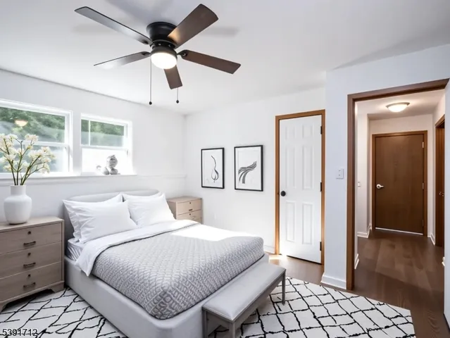a bedroom with a bed and a walk in closet