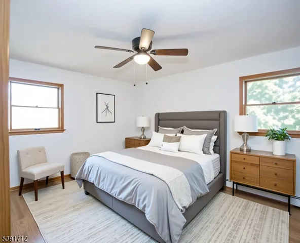 a bedroom with a bed and a couch