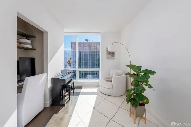 a living room with furniture flowerpot and a potted plant