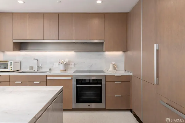 a kitchen with a stove and a sink