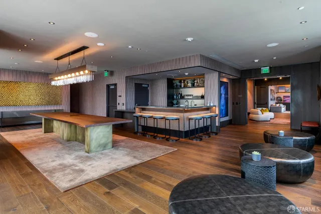 a media room with lots of chairs and a projector screen