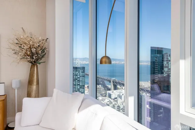 a bedroom with a bed and a potted plant