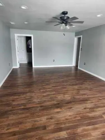 a view of a water heater room with a ceiling fan