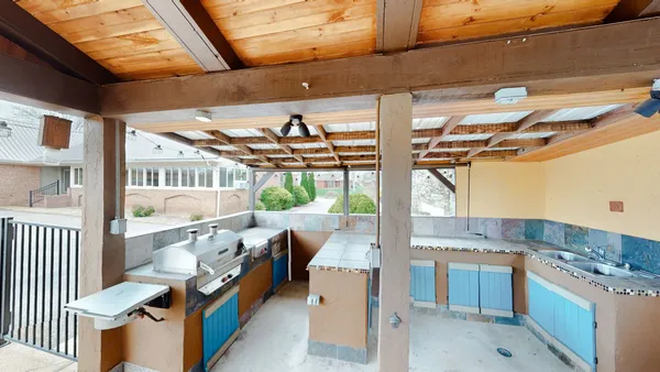 a view of a kitchen with wooden floor and a kitchen