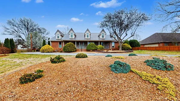 a view of a house with snow on the ground