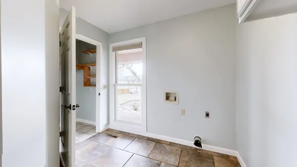 a large bathroom with a large mirror vanity and shower