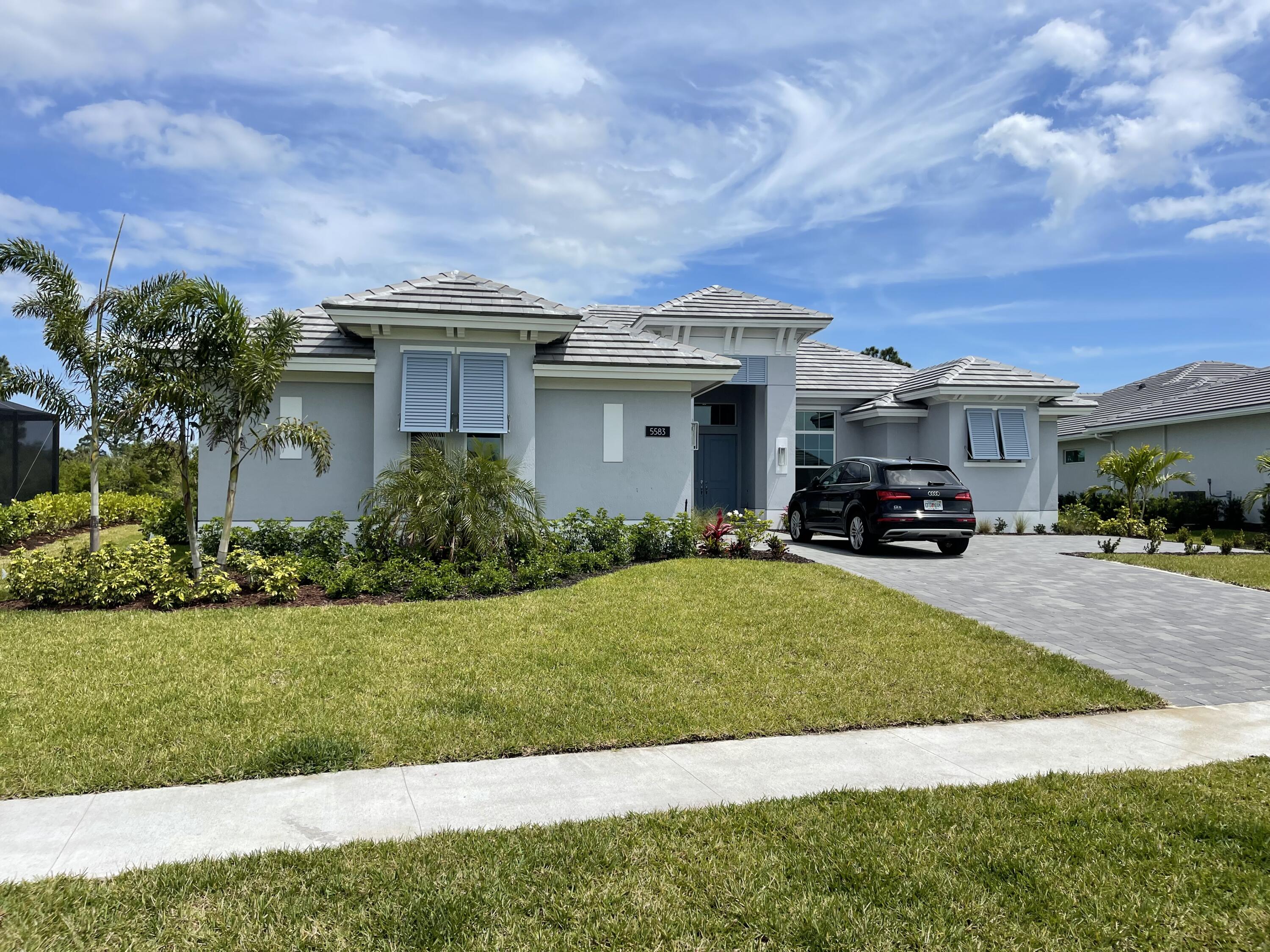 5583 Bent Pine Square Vero Beach, FL 32967 - Photo 1 of 1 a car parked in front of a house