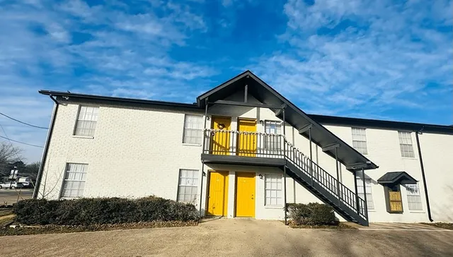 a view of a house with a street