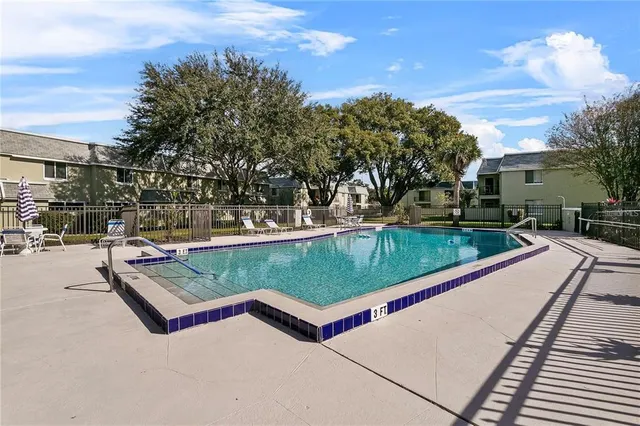 a view of a pool with a yard