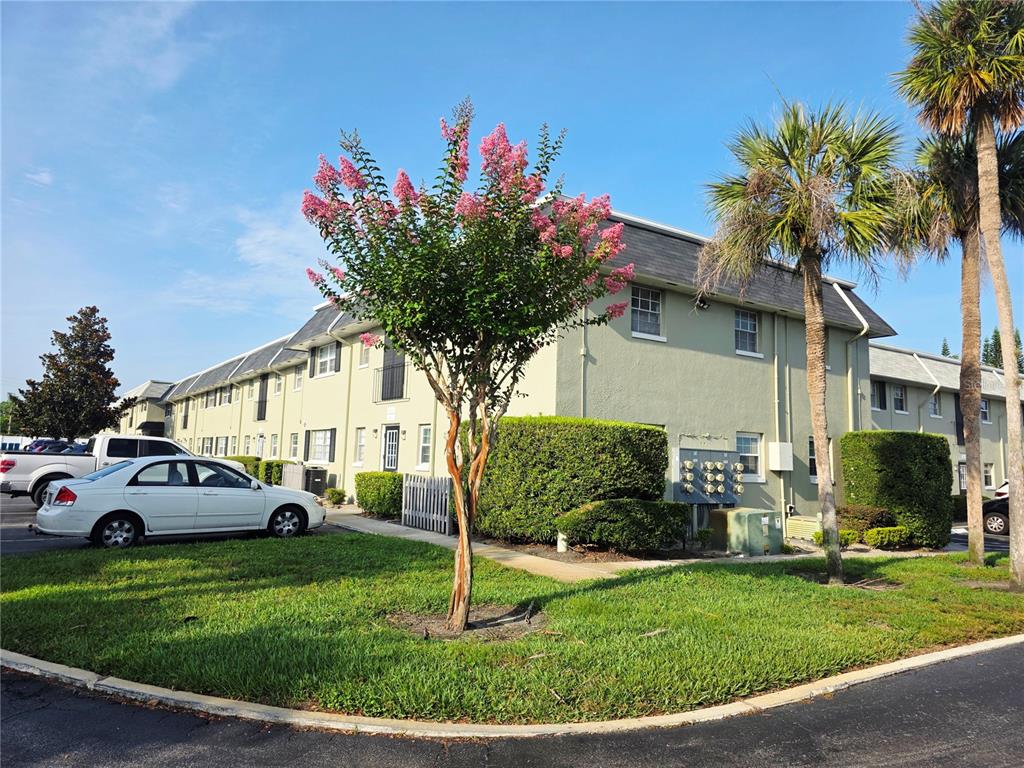 525 South Conway Road, Unit 53 Orlando, FL 32807 - Photo 3 of 12 a front view of a house with a garden and plants