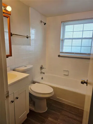 a bathroom with a sink a toilet and a bathtub
