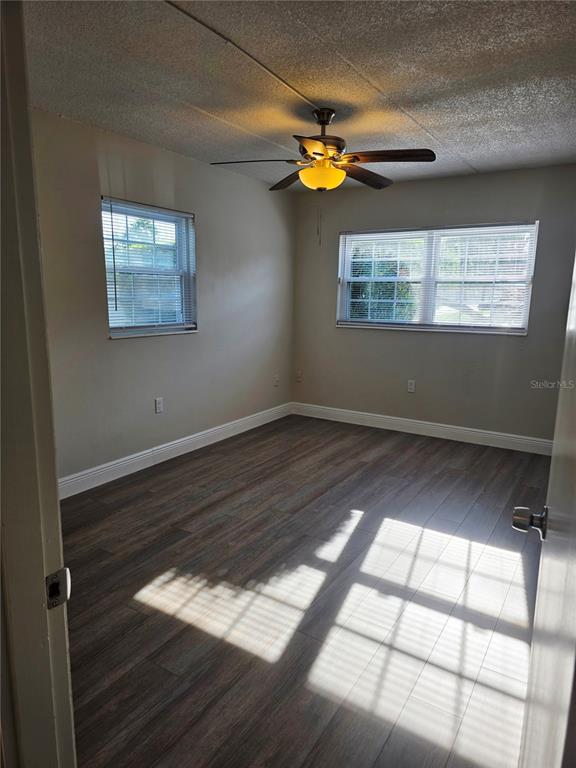525 South Conway Road, Unit 53 Orlando, FL 32807 - Photo 10 of 12 a view of a small space with wooden floor and a window